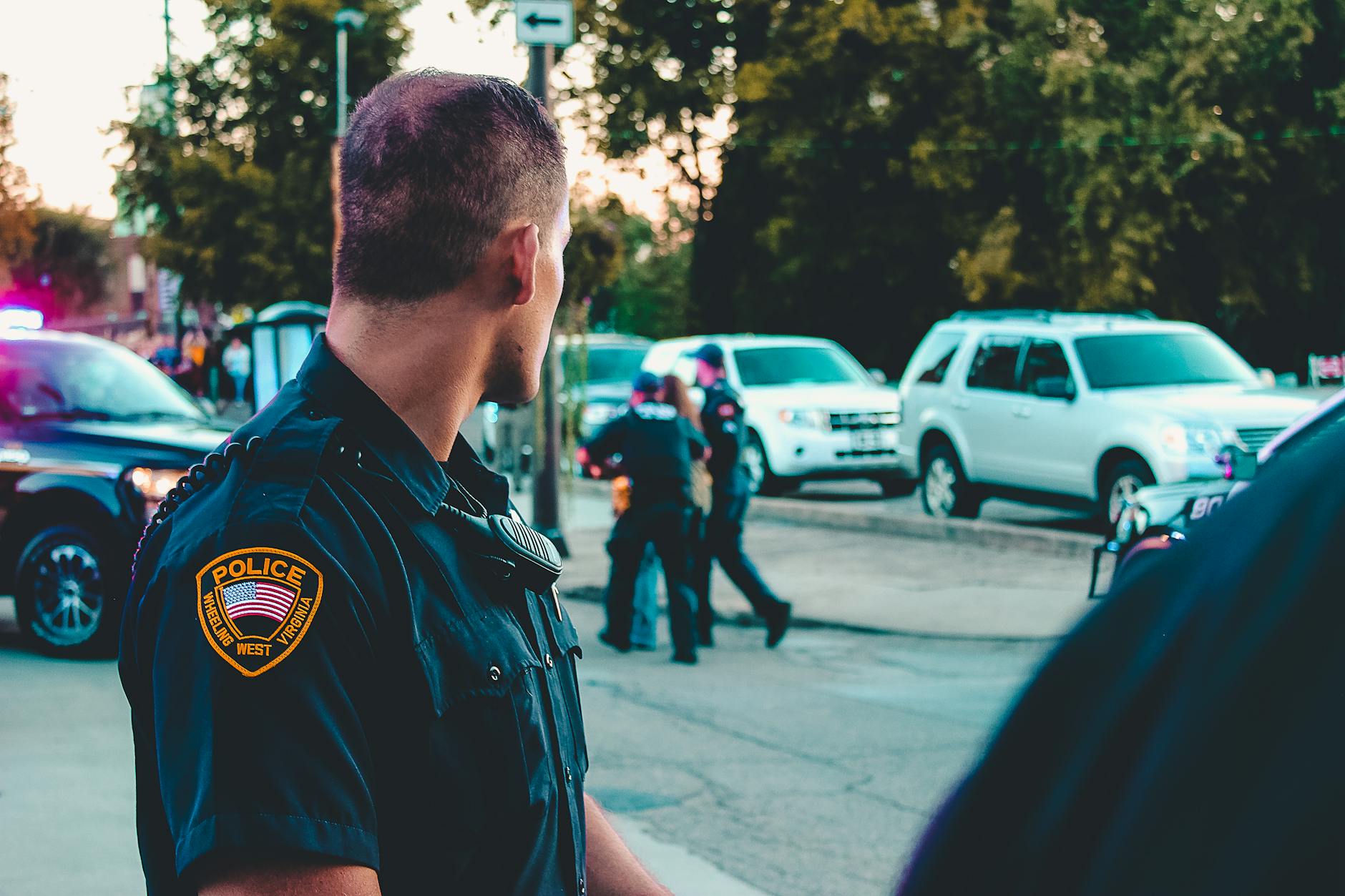 man wearing black officer uniform